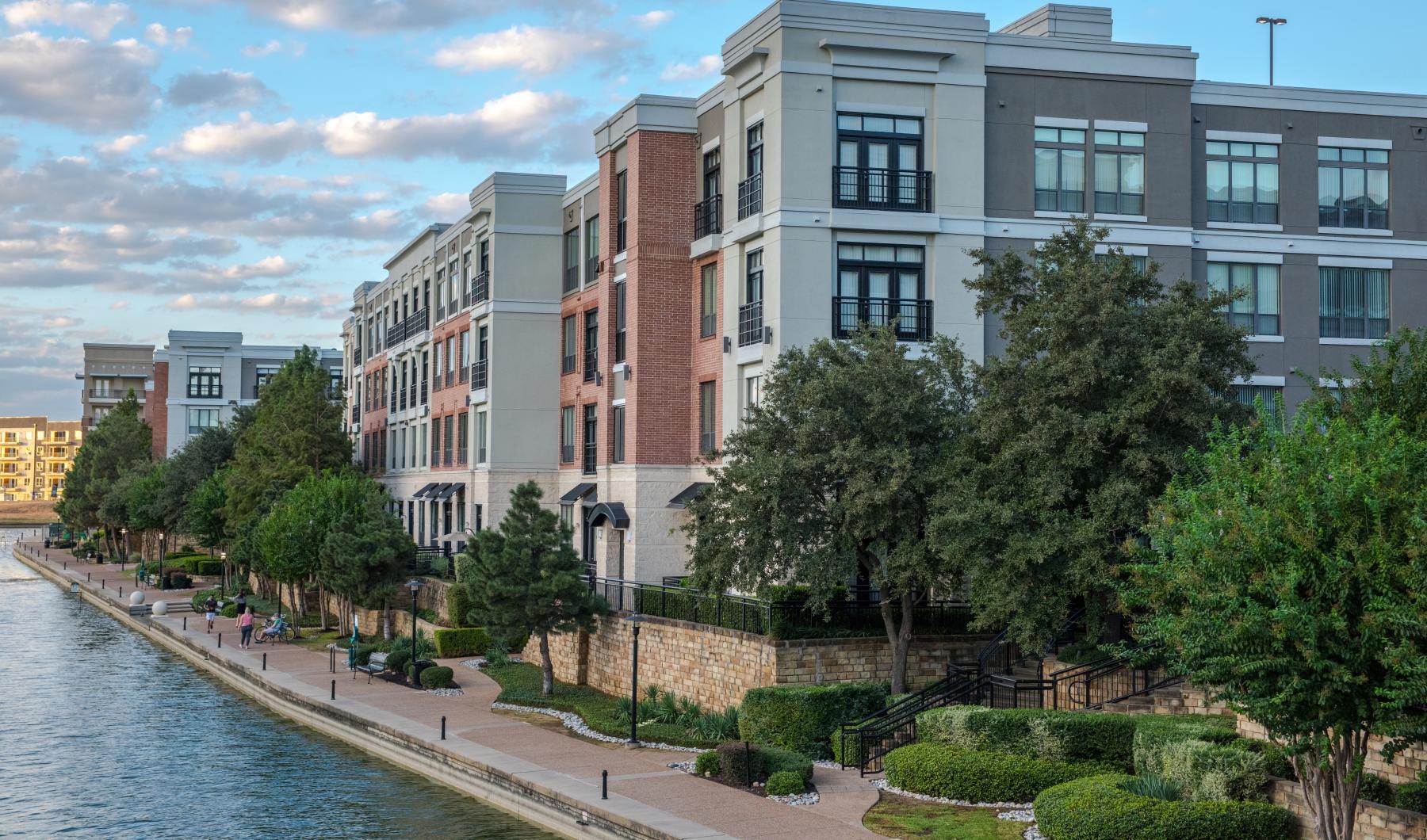 a body of water with buildings along it