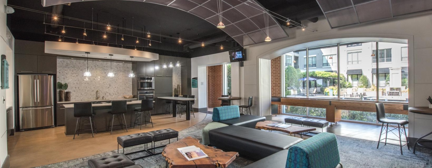 a room with a couch and chairs