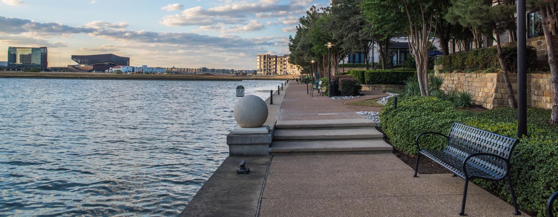 a bench next to a body of water